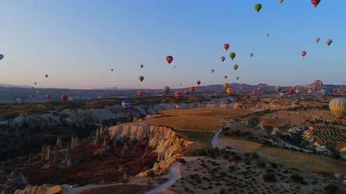 Breathtaking Hot Air Balloons Flying Over Cappadocia Landscape