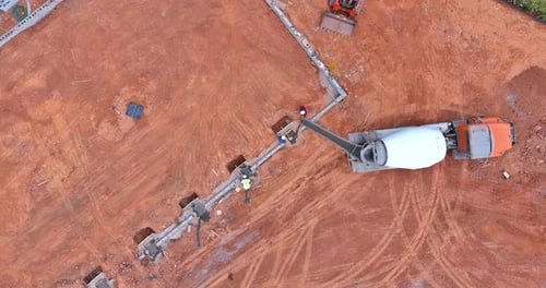 An Used a Concrete Mixer Truck to Pour Concrete Columns on a New House