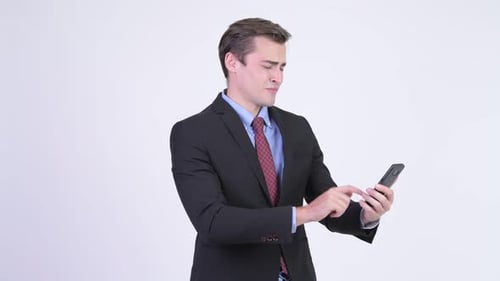 Man in Suit Receives Bad News on Phone