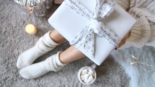 Cozy Winter Scene with Gift Box and Cocoa