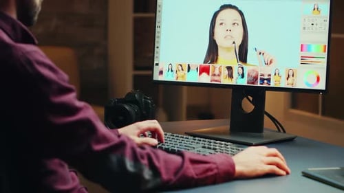 Talented Photographer in Home Office at Night