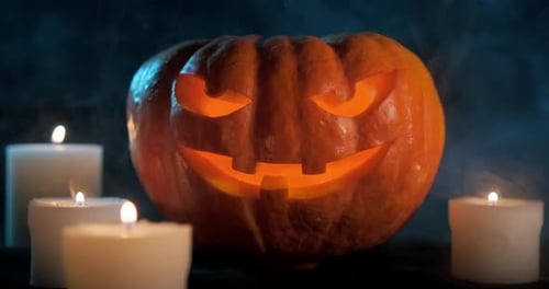 Glowing Jack-o'-lantern with Candles on Halloween Night