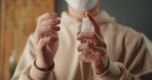 Hands Sanitizing with Hand Sanitizer Indoors