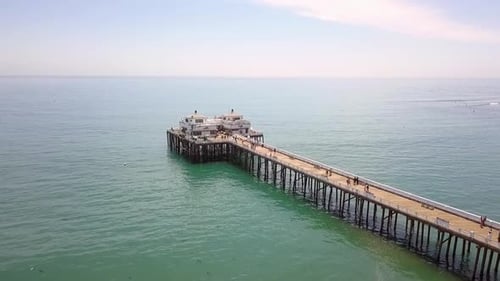 Weekend walk on the malibu Sport Fishing pier
Buttery soft aerial view flight slowly rising up drone