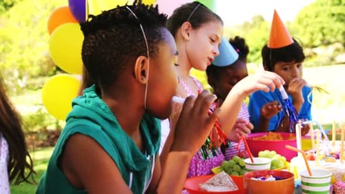 Children Celebrate a Birthday Party at Picnic Table