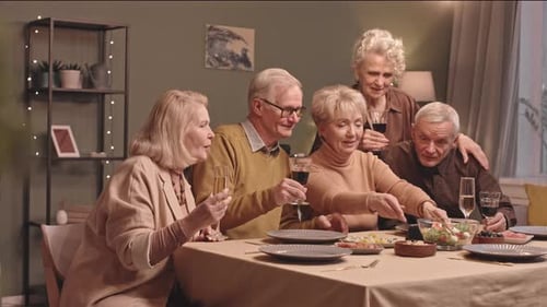 Senior Friends Gather for Video Call and Champagne