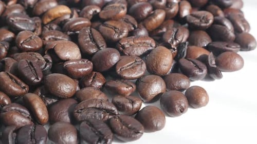 Roasted coffee beans close-up 4K tilt video