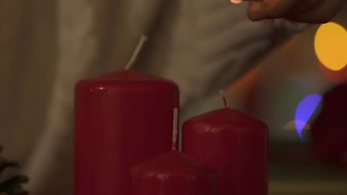 Child Hands Lighting Candles With Match, Fire Safety at Christmas Time, Closeup