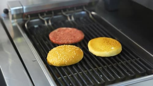 Burger Bun and Patty on Grill Close Up