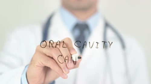 Doctor Writes Oral Cavity Cancer on Glass