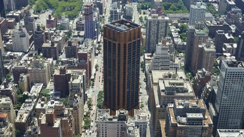 Top view of an urban area of Manhattan on a sunny day with traffic in the streets, static shot.