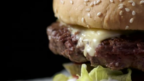 Delicious Cheeseburger with Lettuce, Tomato and Pickles