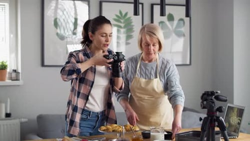 Woman Films Baking Tutorial with Blonde Female Baker