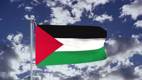 Palestinian Flag Waving against a Cloudy Blue Sky