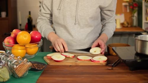 Slicing Apples in Kitchen for Fall Recipe