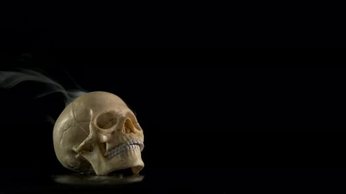 Flowing smoke by the skull.