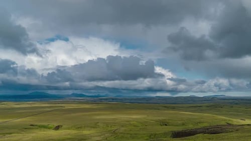 Clouds Move Over the Mountains and Plain in Iceland