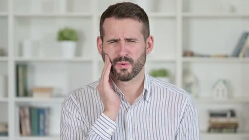 Portrait of Sick Young Man Having Toothache