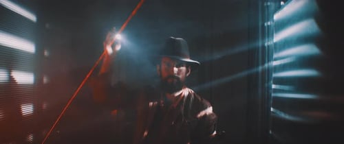 Man with Flashlight in Dark Futuristic Setting