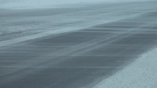 Cars on Winter Road at Blizzard