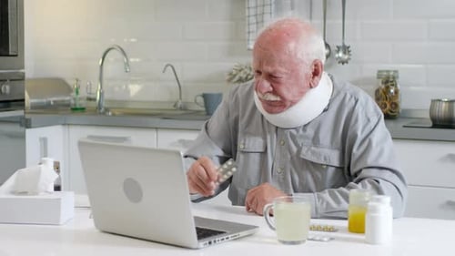 Senior Man with Neck Brace Telehealth Consultation