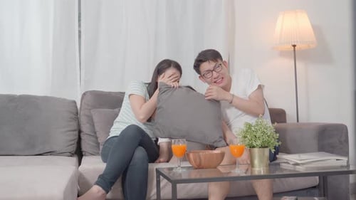 Family Reacting to Scary Movie at Home