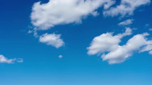 Clouds Pass Across a Brilliant Blue Sky