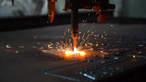 Plasma Cutter Precisely Cutting Metal with Sparks