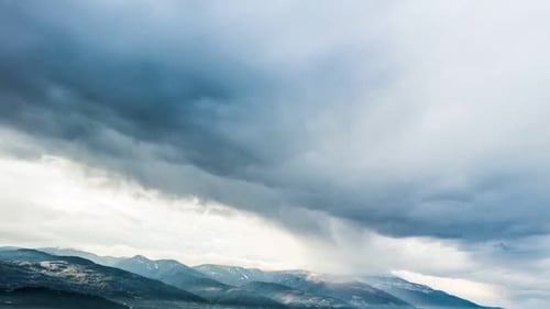 Mountain Range Time Lapse with Approaching Storm Clouds