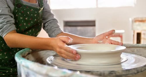 Portrait of girl making pot