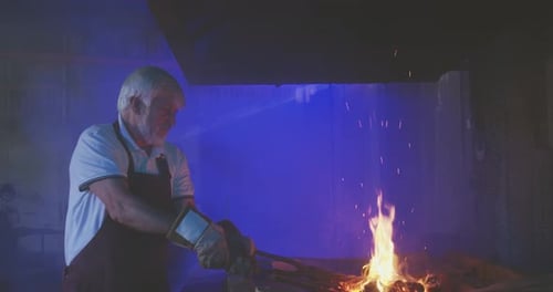 Senior Adult Working in a Fiery Forge