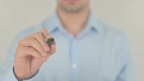 Man Writing the Word 'Worker' on Glass