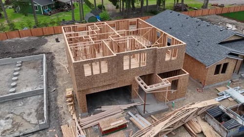 Orbiting aerial of a house under construction in one of America's newly developed neighborhoods.