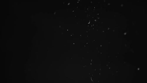 Abstract Ash Falling on Black Background