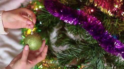 Decorating Christmas Tree with Festive Ornaments