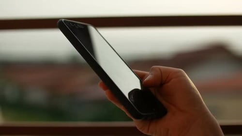 Hand Using Modern Mobile Smartphone Device