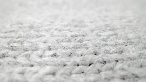 Extreme Detail View of Sheep Wool Cloth Texture Flowing in Macro Dolly Shot