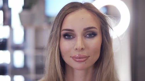 Woman with Glamorous Makeup Posing in Studio