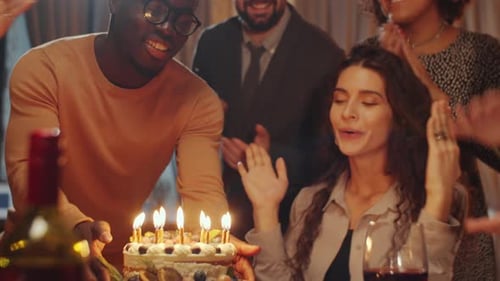 Friends Celebrate a Birthday with Cake and Joy