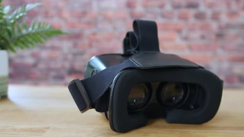 A VR Virtual Reality Headset On A Desk In An Office