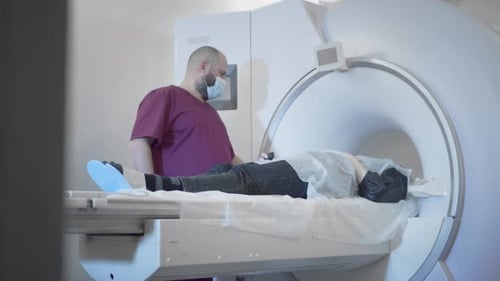 The Doctor Conducts an MRI or PET Scan of a Patient in a Modern Clinic
