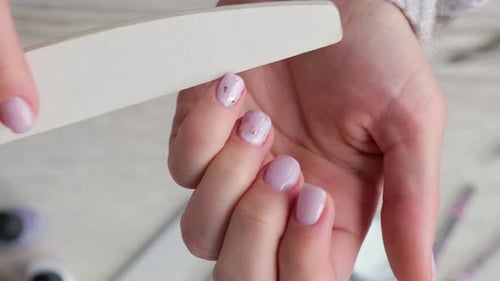 Woman Filing Nails for Manicure, Close Up