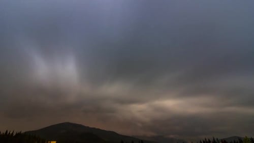 Time-Lapse of Starry Night Sky Over Mountains