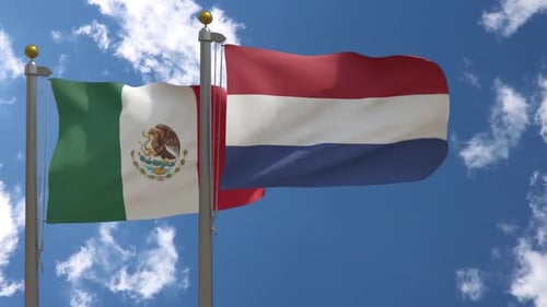 Flags of Mexico and Netherlands Waving in Blue Sky