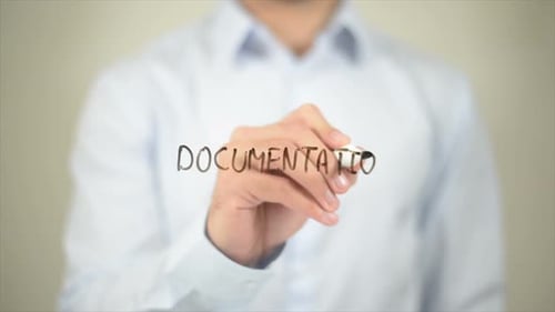 Man Writes 'Documentation' on Clear Surface