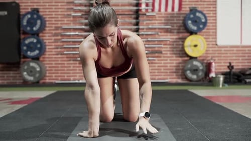 Sportswoman stretching in gym
