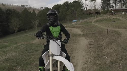 Motocross Rider Poses On Dirt Bike On Trail