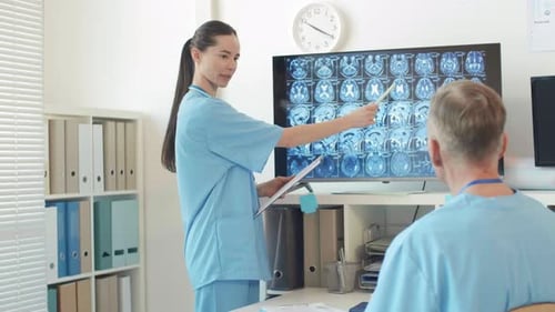 Medical Professionals Reviewing Brain Scan in Office