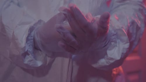 Unrecognizable Caucasian Doctor in Protective Gloves Applying Antiseptic Disinfectant