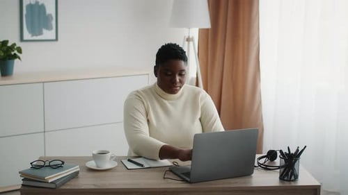 African American Business Lady Using Laptop Sitting At Workplace Indoor